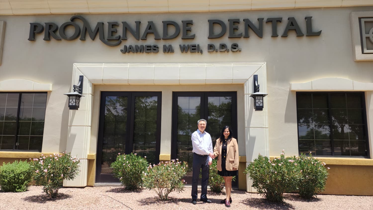 Dr. James Wei and Dr. Shriya Sarin outside Promenade Dental in Chandler